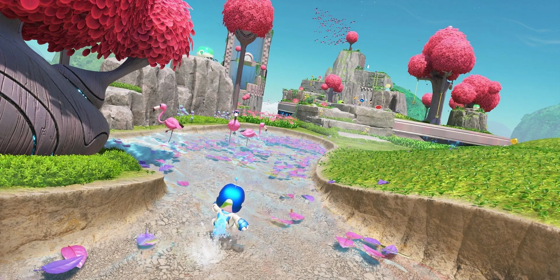 Astro Bot chạy nhảy giữa đàn hồng hạc trong thế giới rực rỡ