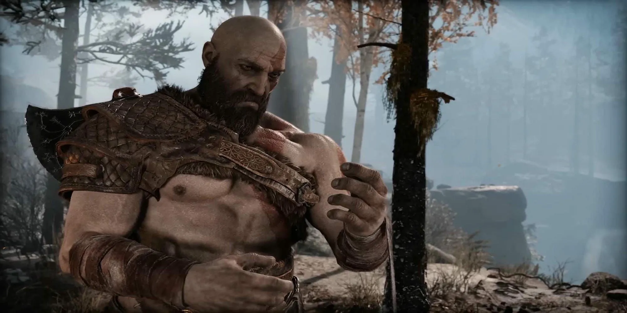 Kratos trông buồn bã trong God of War