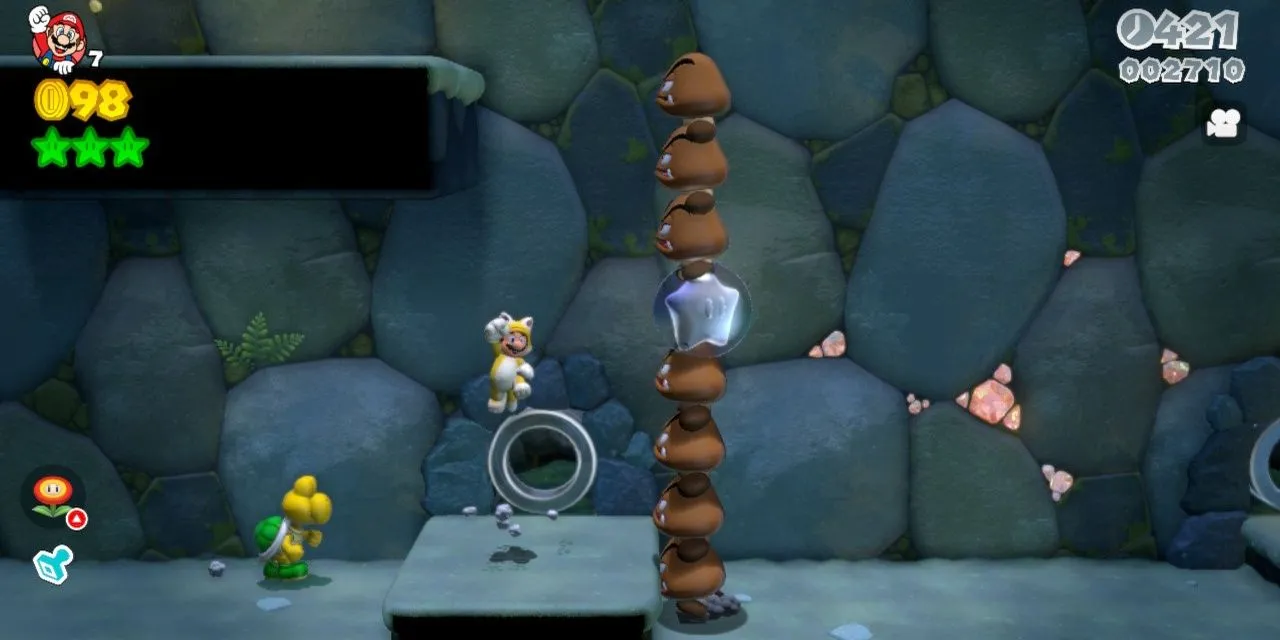 Mario trong bộ đồ mèo đang vượt qua một màn chơi đầy màu sắc trong Super Mario 3D World