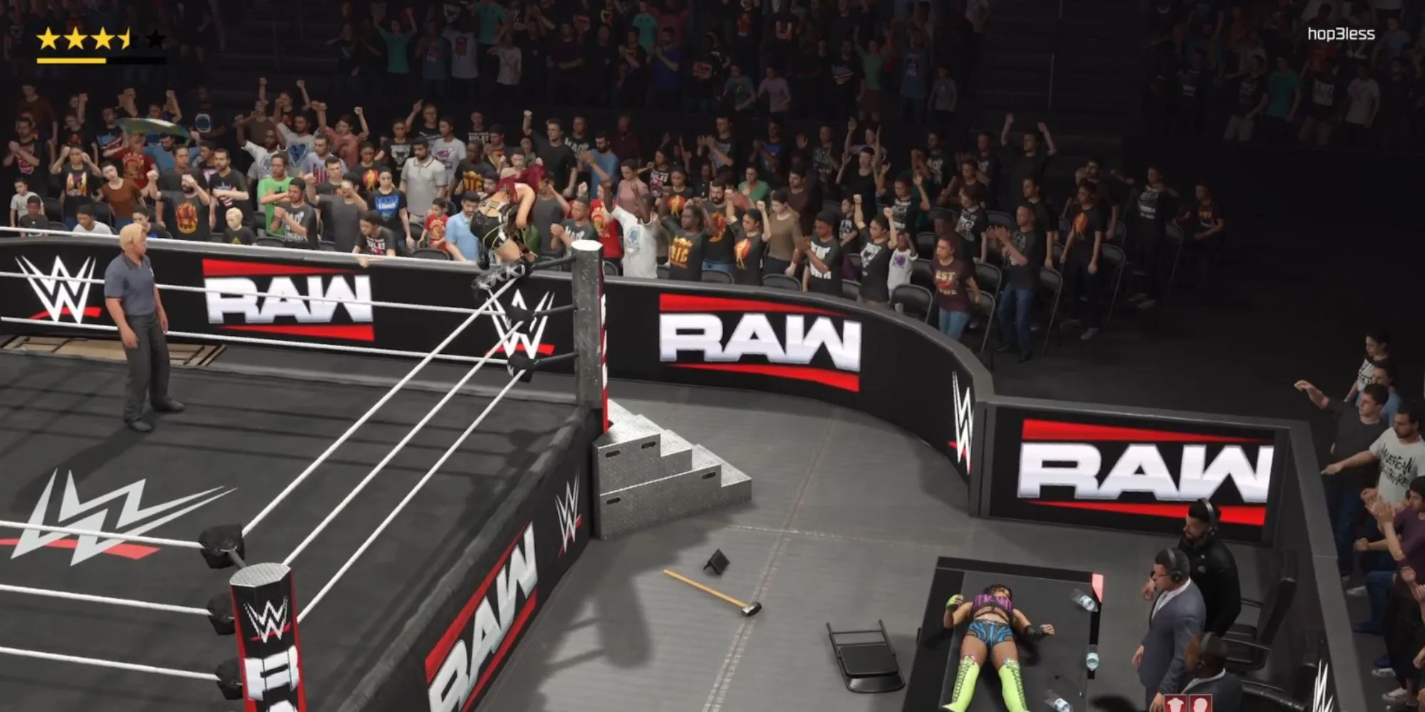 Một đô vật thực hiện cú nhảy từ cột góc đài phá bàn bình luận trong game WWE 2K25