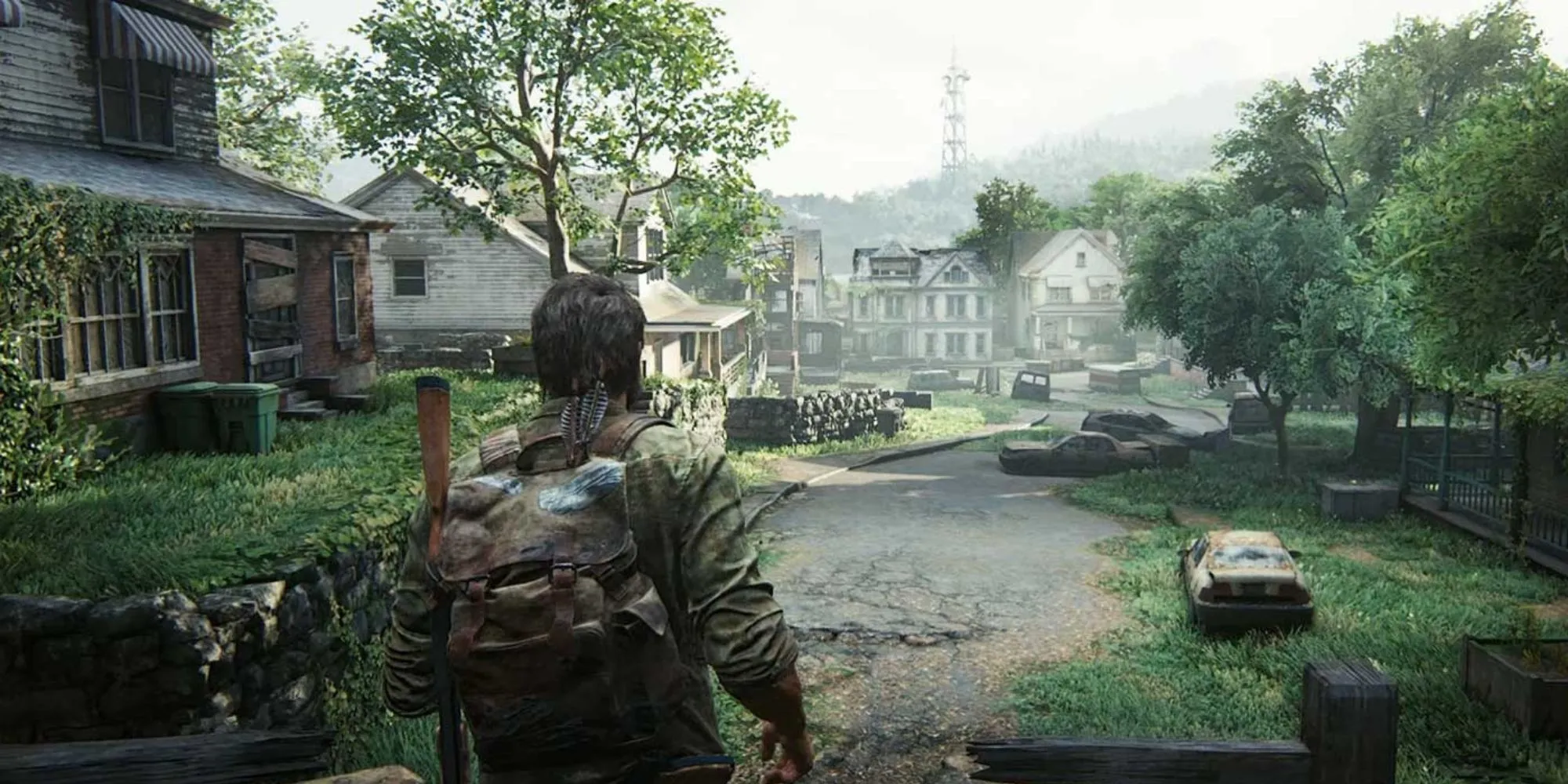 Nhân vật đi qua một thị trấn đổ nát trong The Last of Us Part 1