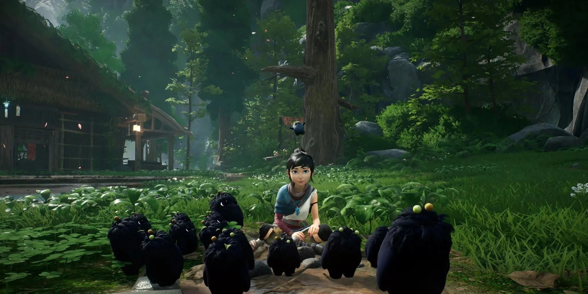 Nữ pháp sư Kena cùng những sinh vật nhỏ đáng yêu Rot trong Kena: Bridge of Spirits.