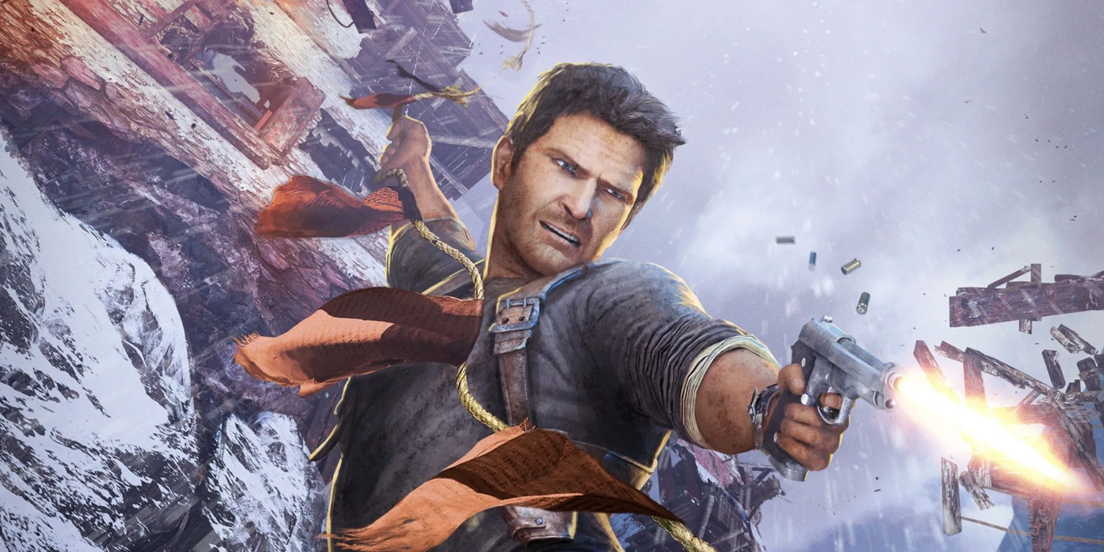 Bìa game với hình ảnh Nathan Drake treo lơ lửng trên một chuyến tàu và bắn súng ở New York trong Uncharted 2: Among Thieves.