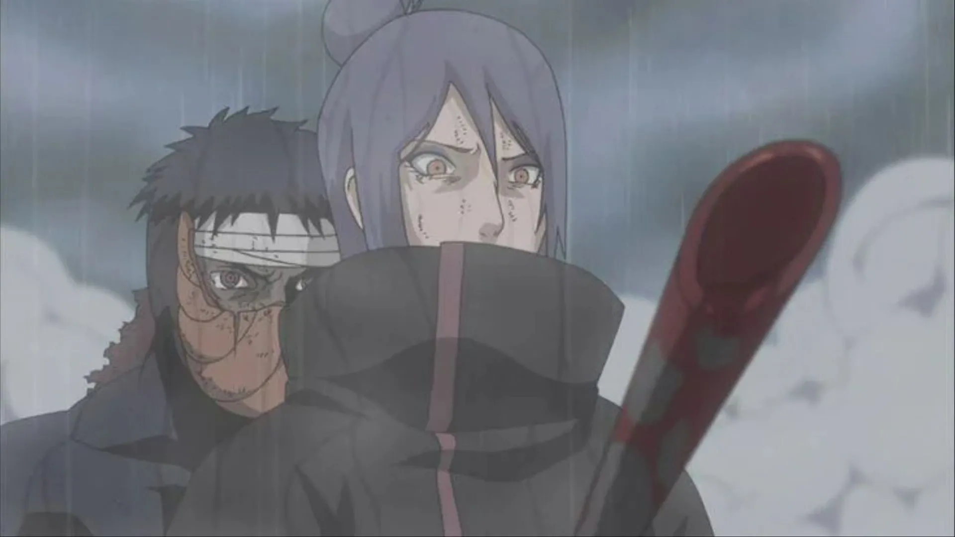 Obito (Tobi) đâm xuyên ngực Konan trong trận chiến, gây ra cái chết của cô