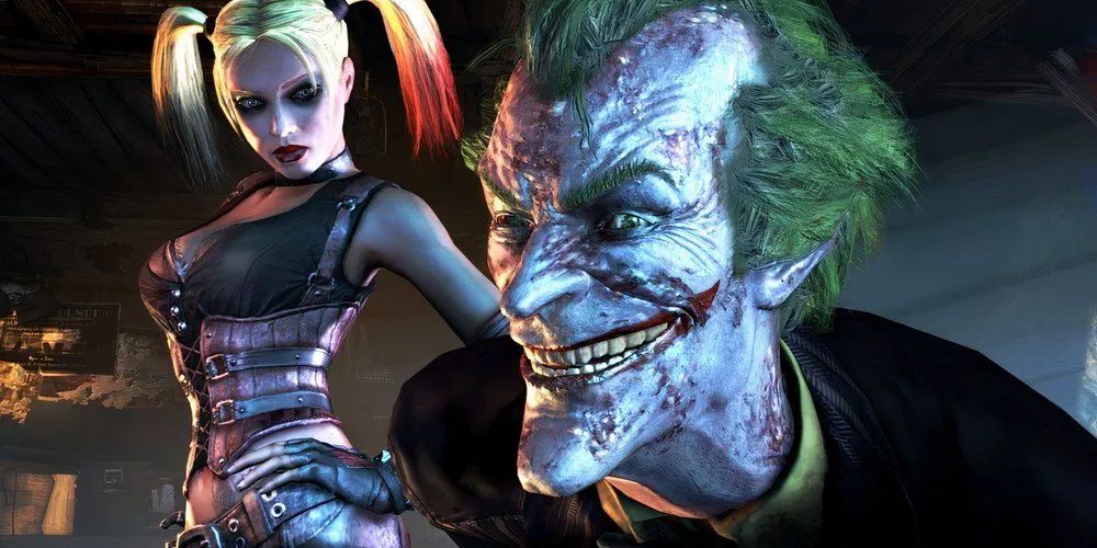 Joker ốm yếu cười với màn hình cùng Harley Quinn trong Batman Arkham City