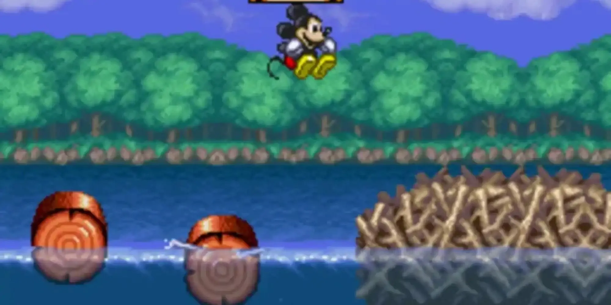 Mickey Mouse trong trang phục pháp sư trong game The Magical Quest Starring Mickey Mouse, thể loại platformer cổ điển.