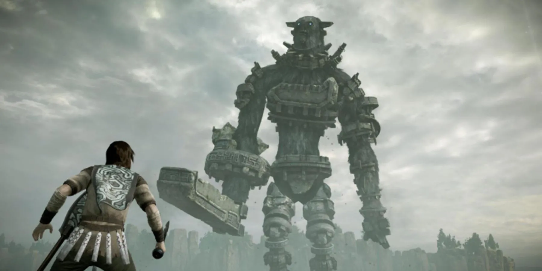 Wander chuẩn bị đối mặt với Colossus khổng lồ trong Shadow of the Colossus, thể hiện sự cô độc và thử thách của trò chơi.